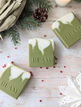 Load image into Gallery viewer, BEAM natural body care natural soap bars.  Three green and white soap bars on a wooden board.  Christmas soap.
