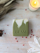 Load image into Gallery viewer, BEAM natural body care natural christmas soap on a   wooden board.  Best natural soap.  Green and white. 
